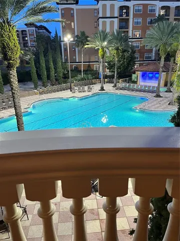 a view of a patio with table and chairs potted plants