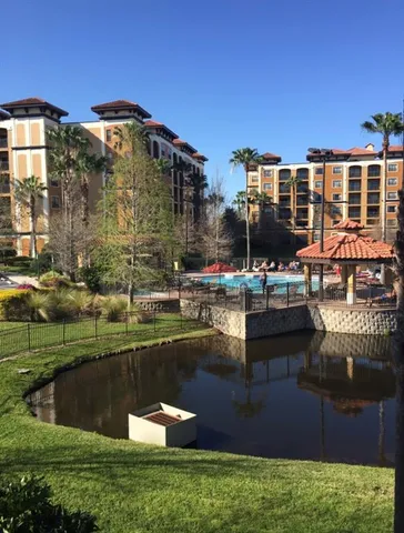 a swimming pool with outdoor seating and yard