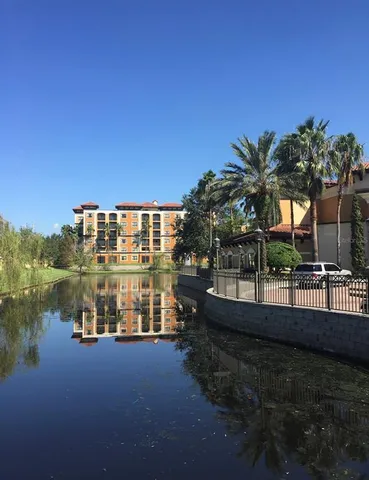 a view of a lake with a building in the background