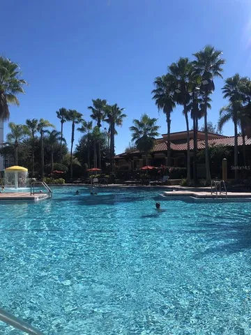 a view of swimming pool with a yard