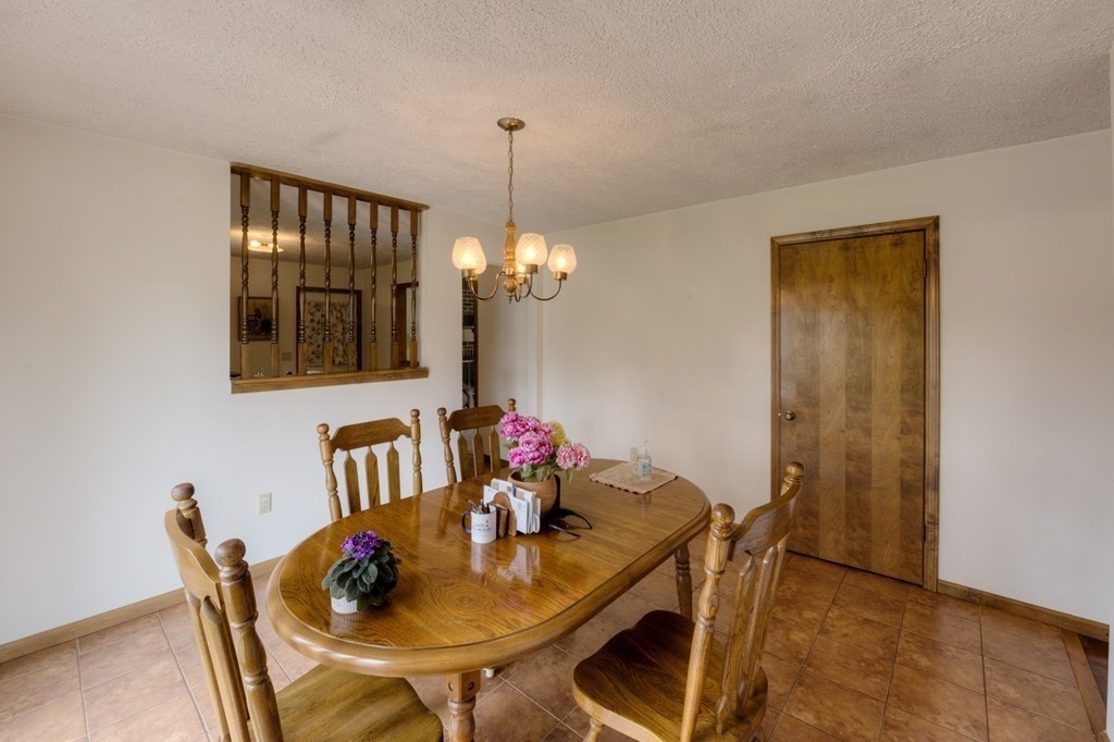 23 Riverside Street Three Rivers, MA 01080 - Photo 13 of 33 a view of a dining room with furniture and chandelier