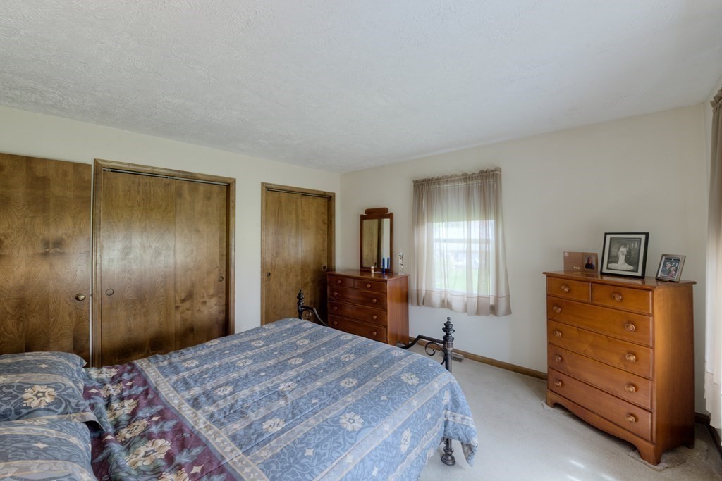 23 Riverside Street Three Rivers, MA 01080 - Photo 16 of 33 a bedroom with a bed and a dresser