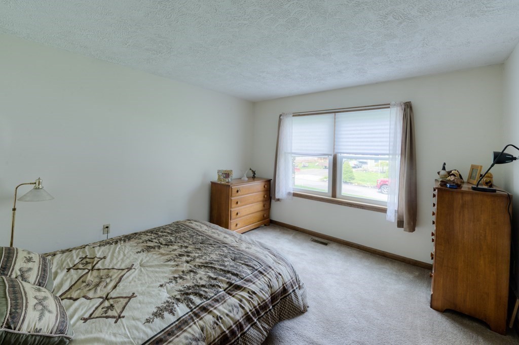 23 Riverside Street Three Rivers, MA 01080 - Photo 18 of 33 a bedroom with a bed and a window
