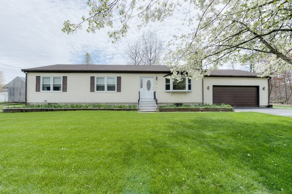 23 Riverside Street Three Rivers, MA 01080 - Photo 2 of 33 a front view of house with yard and green space
