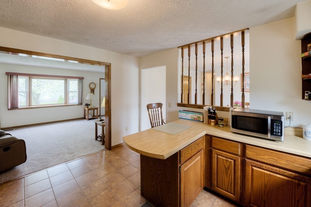 23 Riverside Street Three Rivers, MA 01080 - Photo 7 of 33 a kitchen with stainless steel appliances granite countertop a sink and a granite counter tops