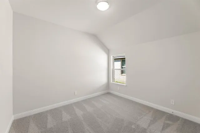 an empty room with a empty space and window