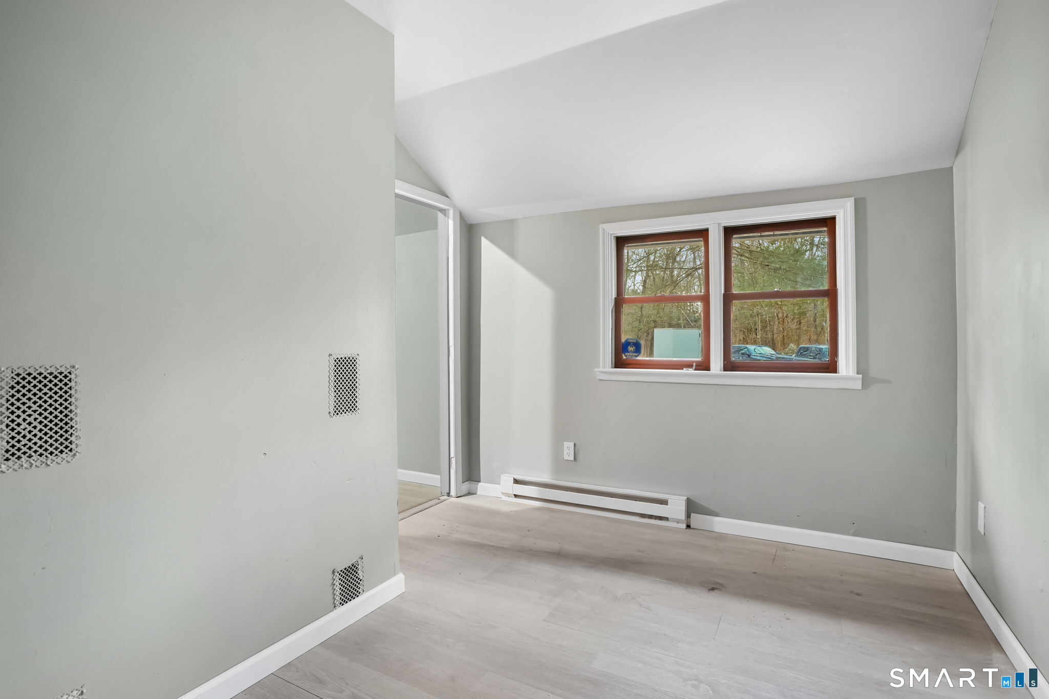 71 Picketts Ridge Road Redding, CT 06896 - Photo 18 of 32 an empty room with windows