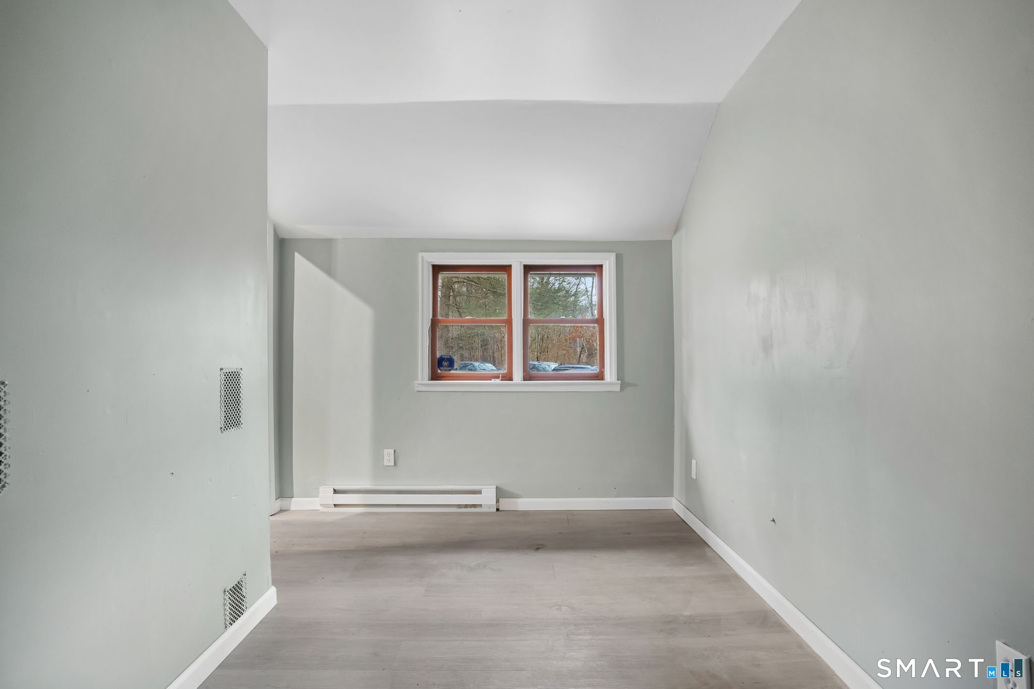 71 Picketts Ridge Road Redding, CT 06896 - Photo 19 of 32 an empty room with windows