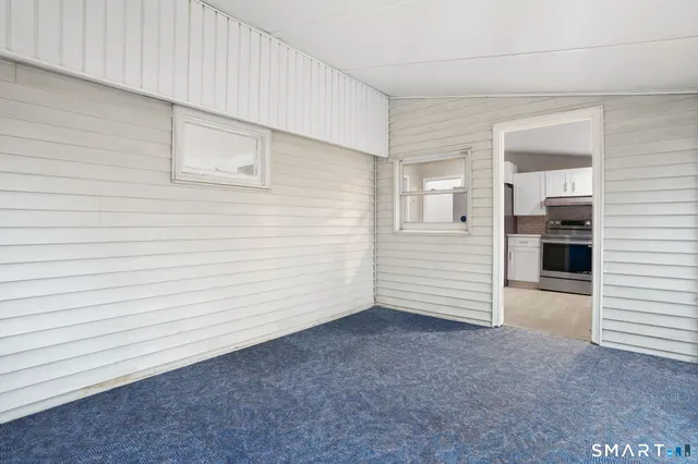 a view of a kitchen cabinets and a window