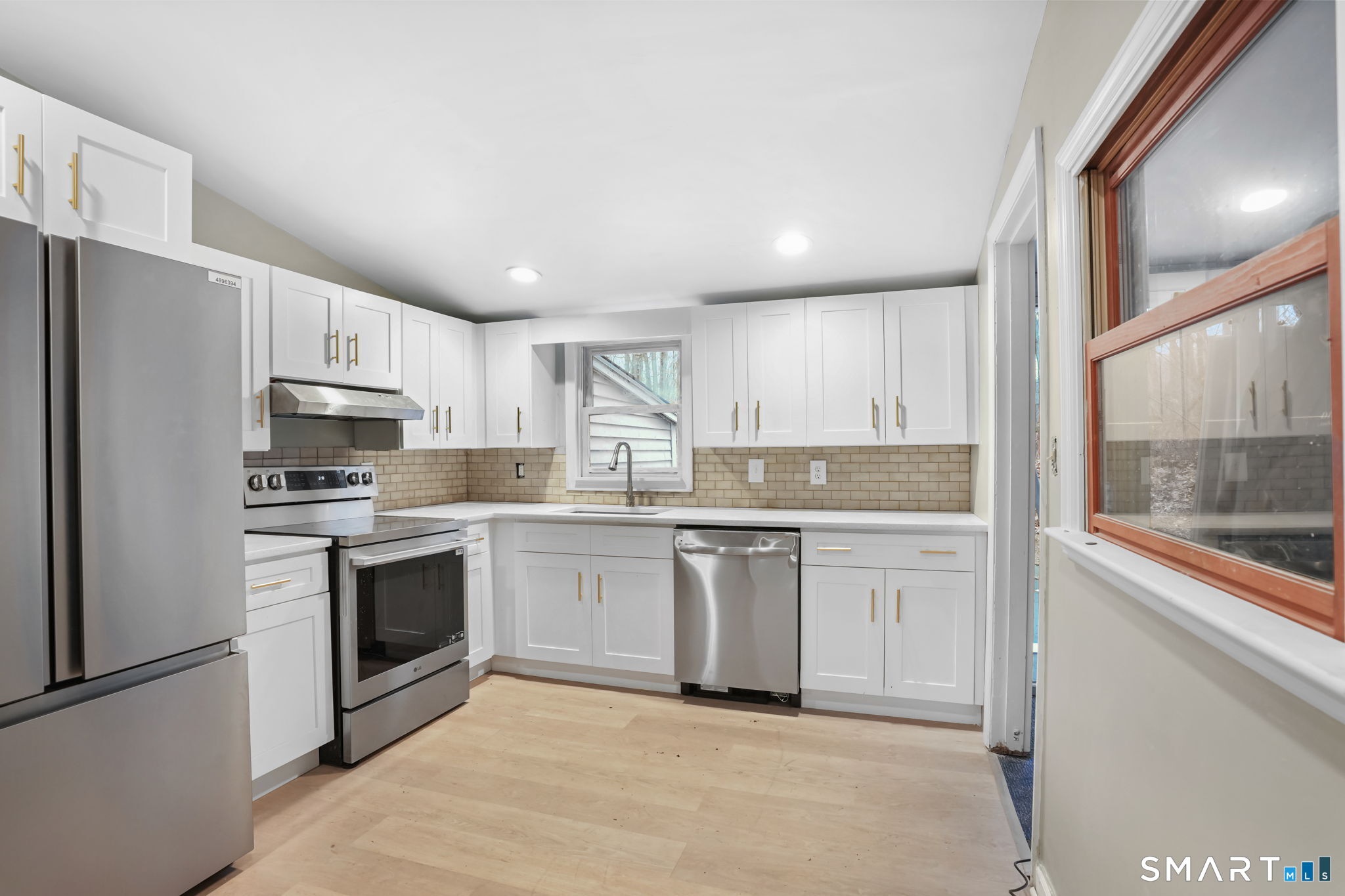 71 Picketts Ridge Road Redding, CT 06896 - Photo 23 of 32 a kitchen with granite countertop cabinets stainless steel appliances and a sink