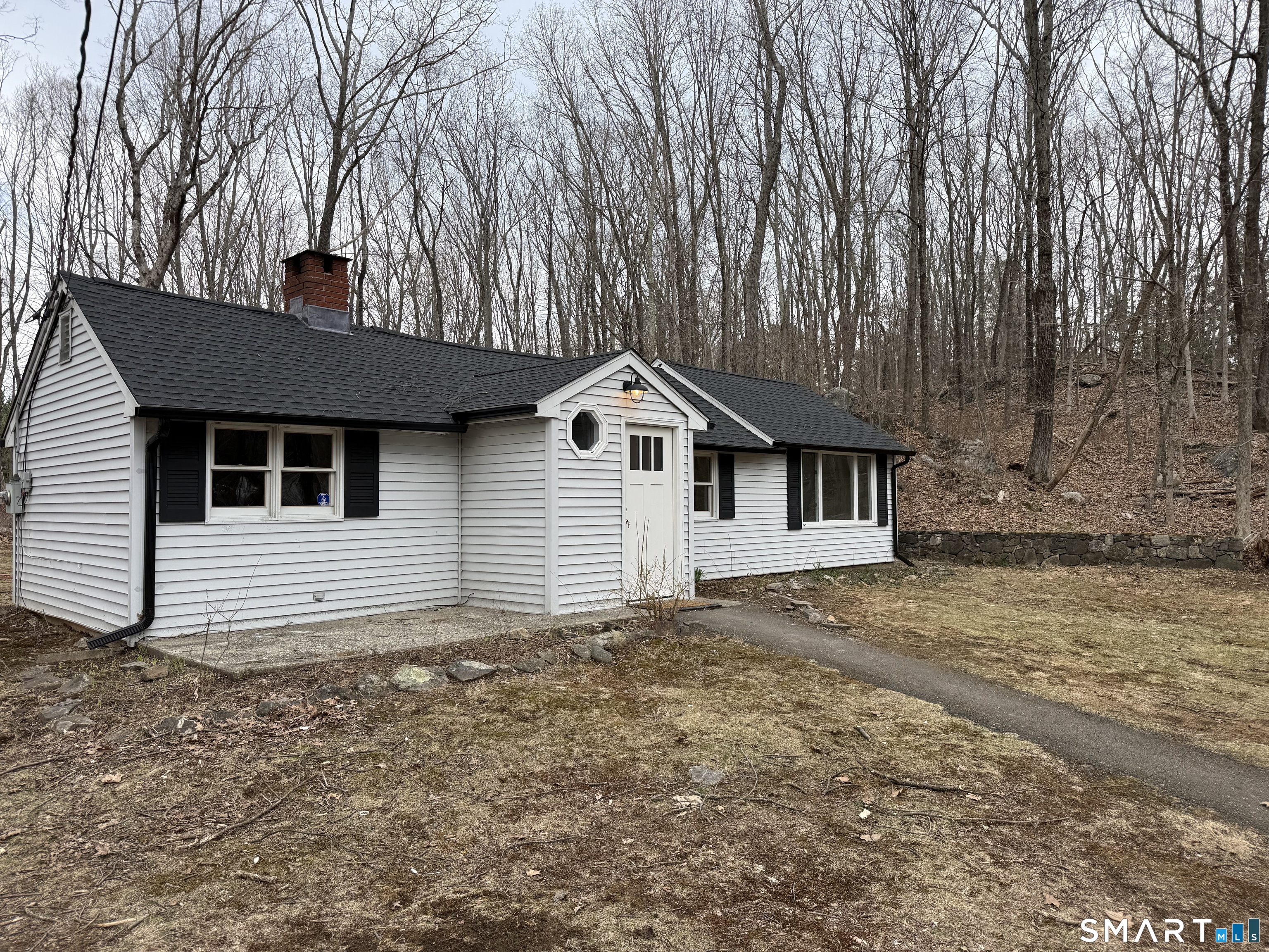 71 Picketts Ridge Road Redding, CT 06896 - Photo 29 of 32 a front view of a house with a yard