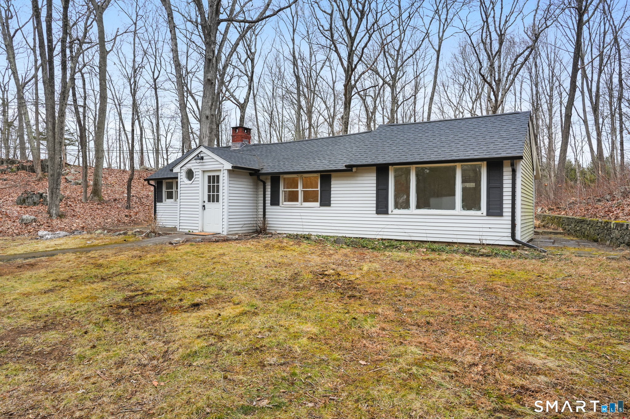 71 Picketts Ridge Road Redding, CT 06896 - Photo 3 of 32 a house with trees in front of it