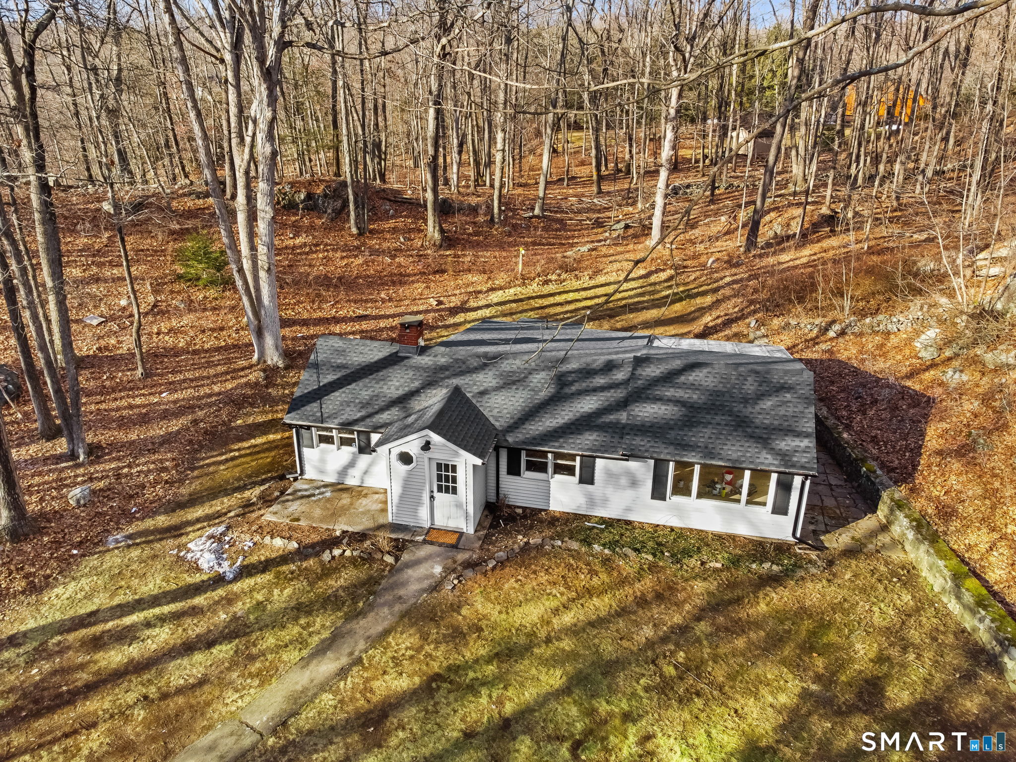 71 Picketts Ridge Road Redding, CT 06896 - Photo 7 of 32 a front view of a house with a yard