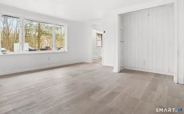 a view of an empty room with a window