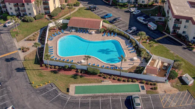a view of swimming pool with outdoor seating