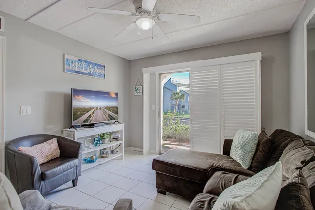 a bedroom with a bed dresser and a window
