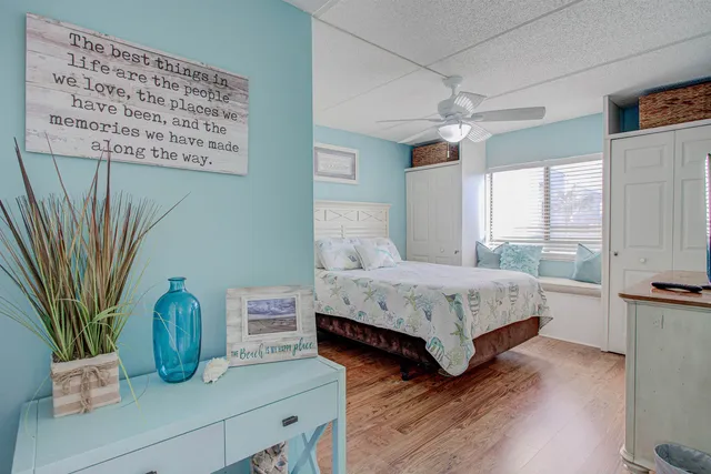 a bedroom with a bed and a lamp