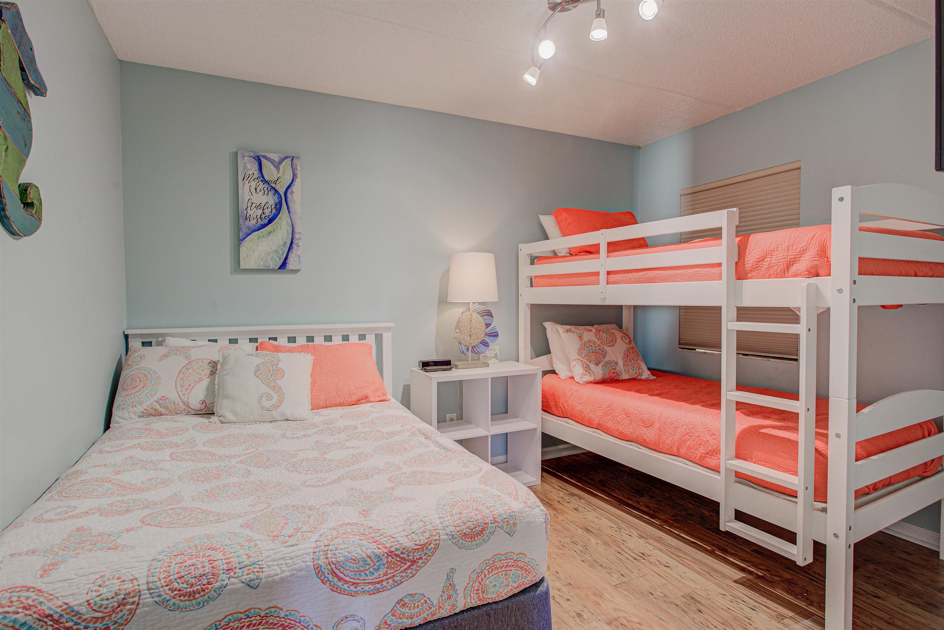 880 A1A Beach Boulevard, Unit 3118 St. Augustine Beach, FL 32080 - Photo 45 of 55 a bedroom with two beds and a couch