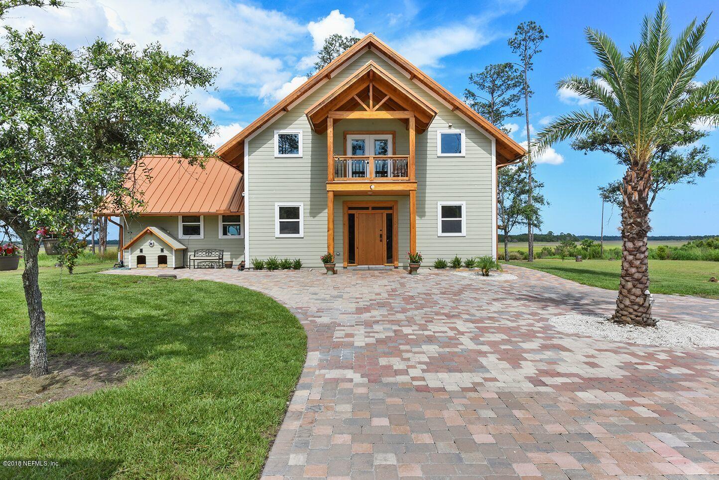 12715 Sawpit Road Jacksonville, FL 32226 - Photo 1 of 35 a view of a house with a yard and large tree