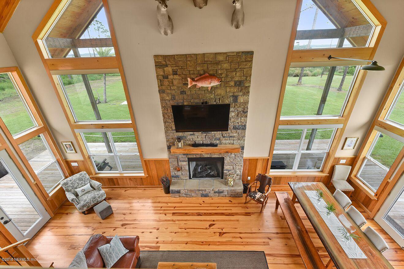 12715 Sawpit Road Jacksonville, FL 32226 - Photo 15 of 35 a view of living room with furniture and a fireplace