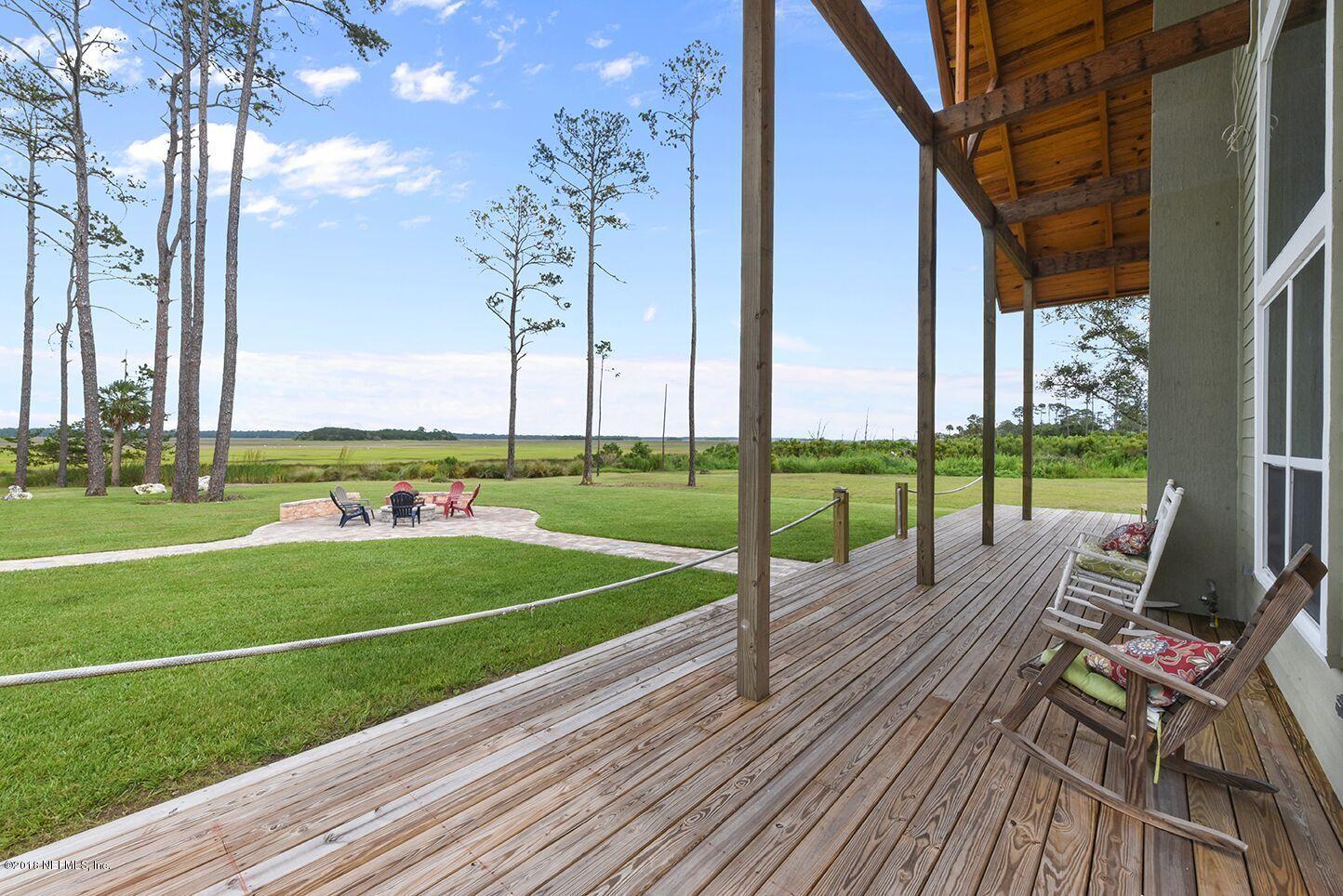 12715 Sawpit Road Jacksonville, FL 32226 - Photo 18 of 35 a view of a deck with a big yard