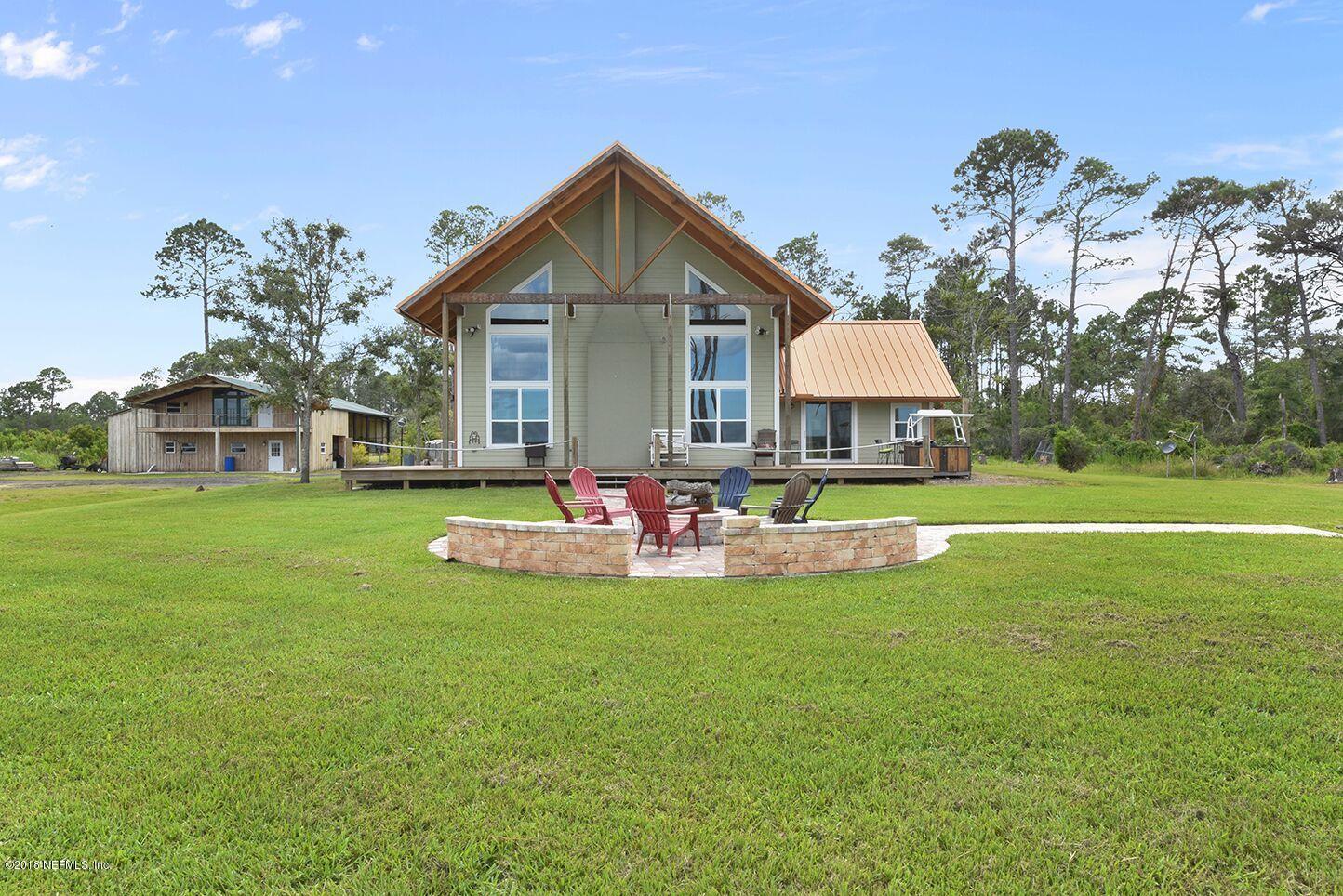 12715 Sawpit Road Jacksonville, FL 32226 - Photo 19 of 35 a view of a house with a yard and sitting area