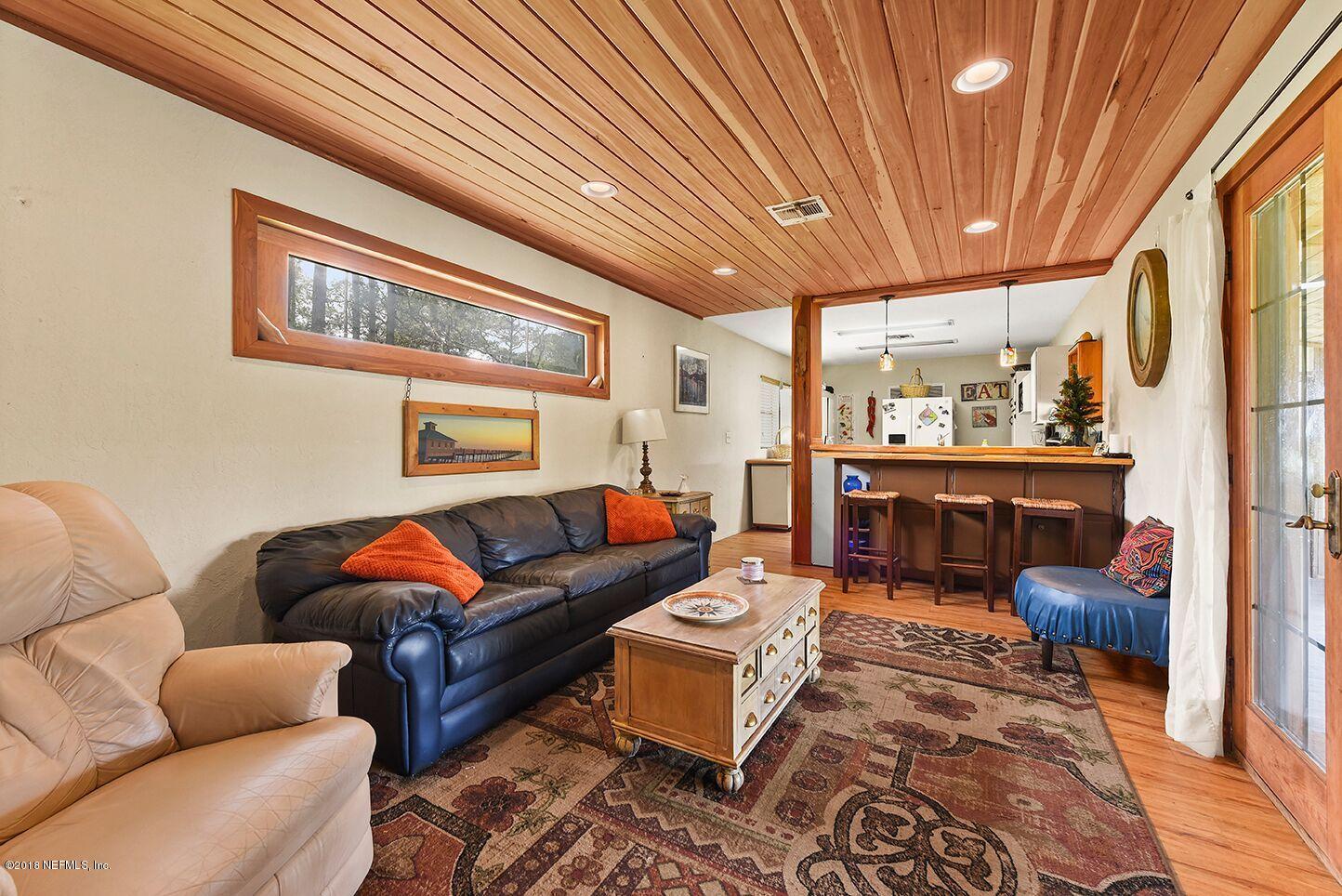 12715 Sawpit Road Jacksonville, FL 32226 - Photo 24 of 35 a living room with furniture and a rug