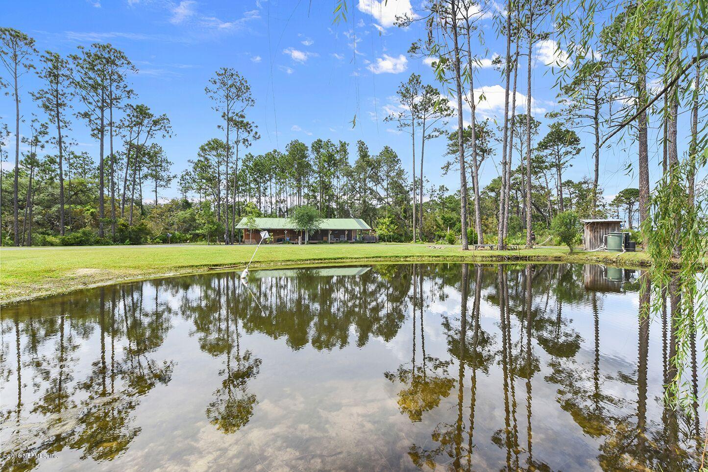 12715 Sawpit Road Jacksonville, FL 32226 - Photo 27 of 35 a view of a lake with a large trees