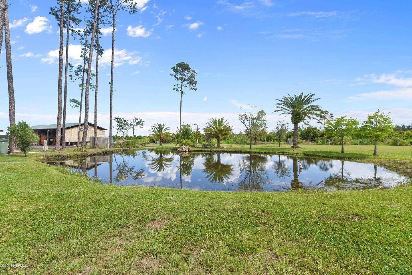 12715 Sawpit Road Jacksonville, FL 32226 - Photo 28 of 35 a view of a swimming pool with a garden