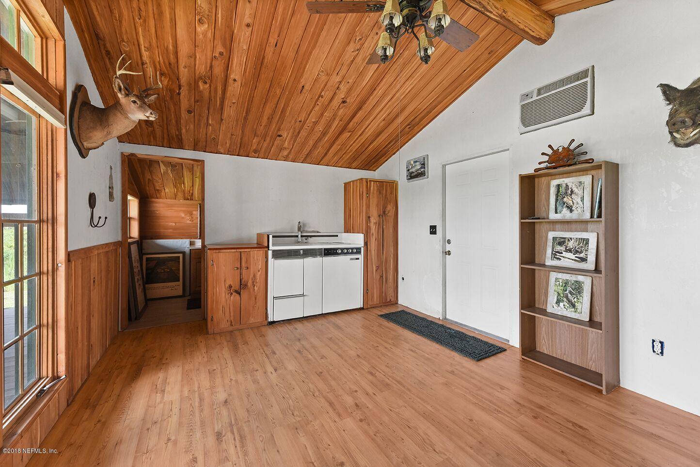 12715 Sawpit Road Jacksonville, FL 32226 - Photo 33 of 35 a kitchen with stainless steel appliances a refrigerator and wooden floor