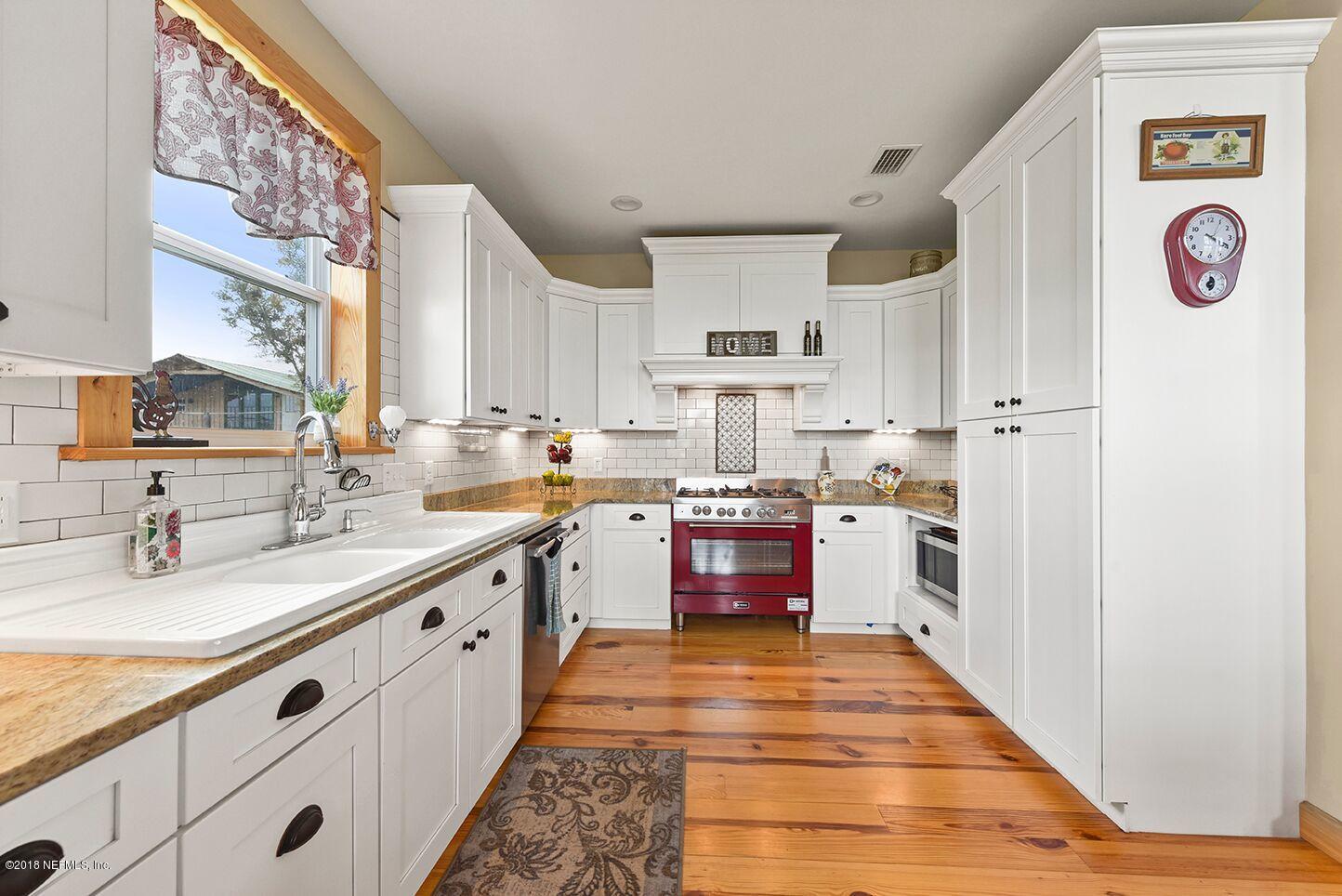 12715 Sawpit Road Jacksonville, FL 32226 - Photo 5 of 35 a large kitchen with stainless steel appliances granite countertop a sink and cabinets