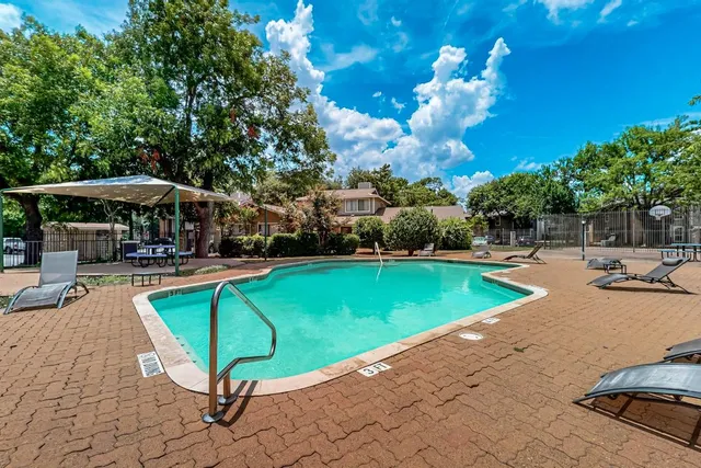 a table and chairs in a patio