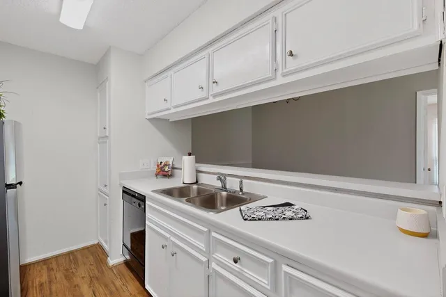 a kitchen that has a sink and a stove