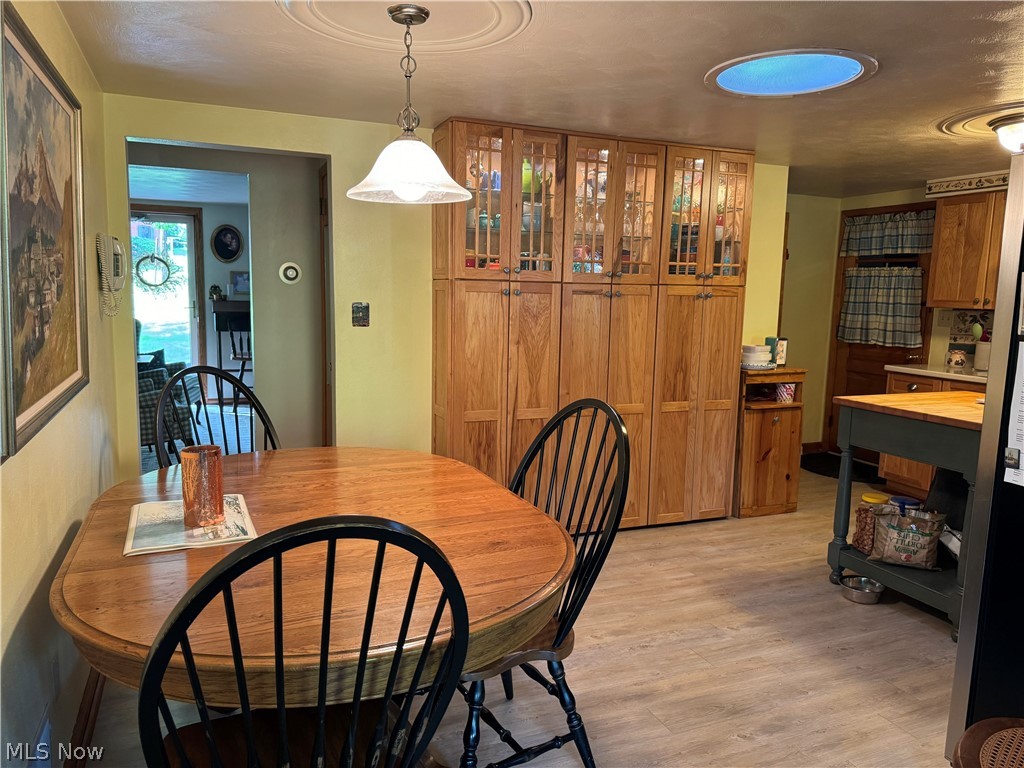 123 E Road Toronto, OH 43964 - Photo 4 of 34 Dining space featuring light wood-type flooring