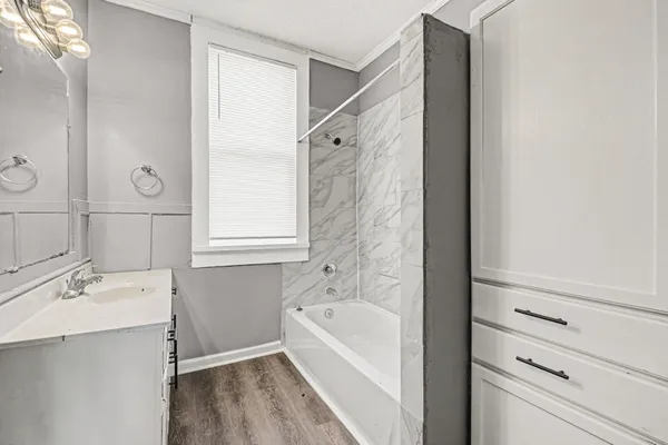 an empty room with a empty space and windows