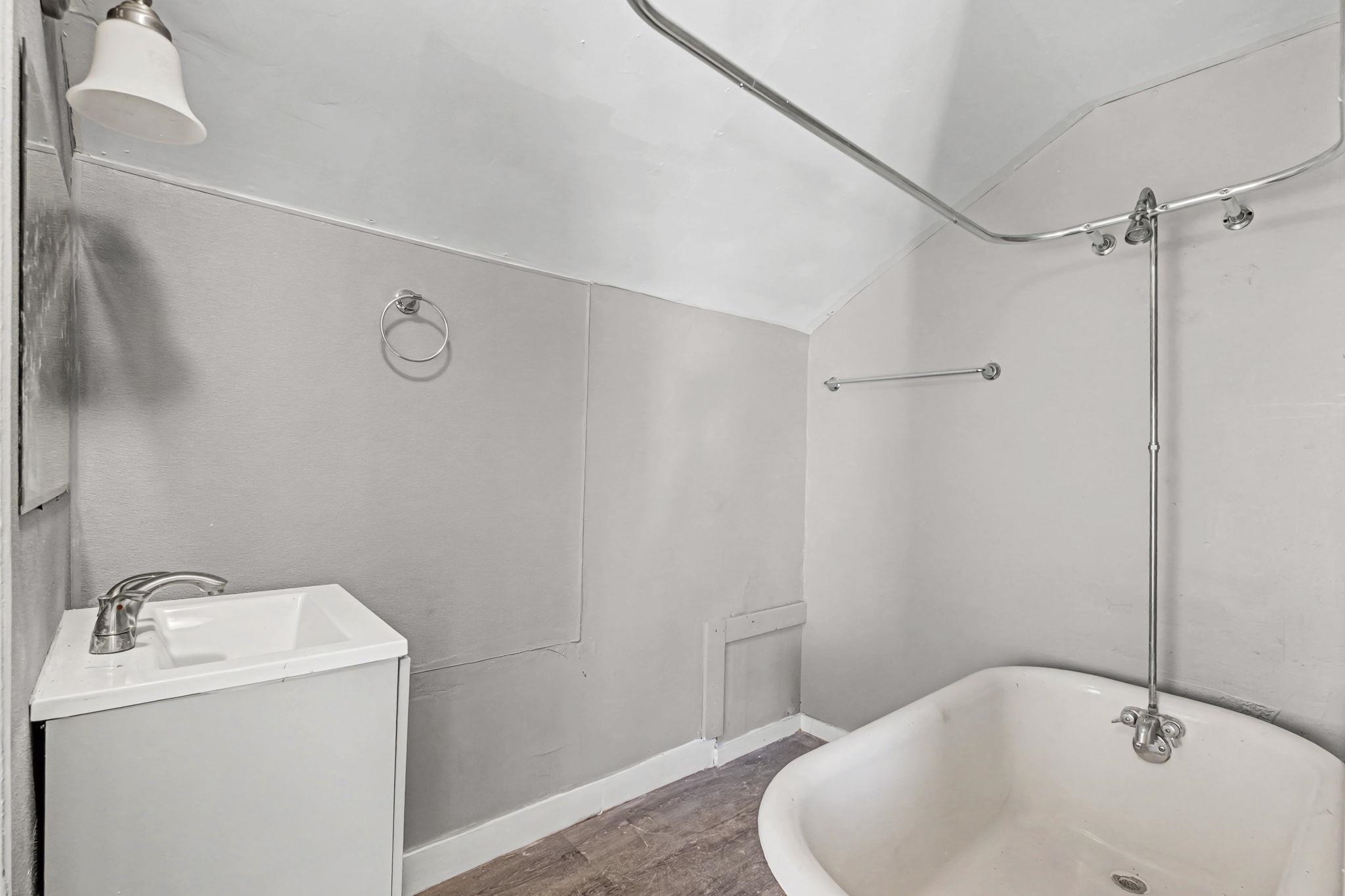 320 North High Street Covington, TN 38019 - Photo 17 of 32 a bathroom with a sink and shower