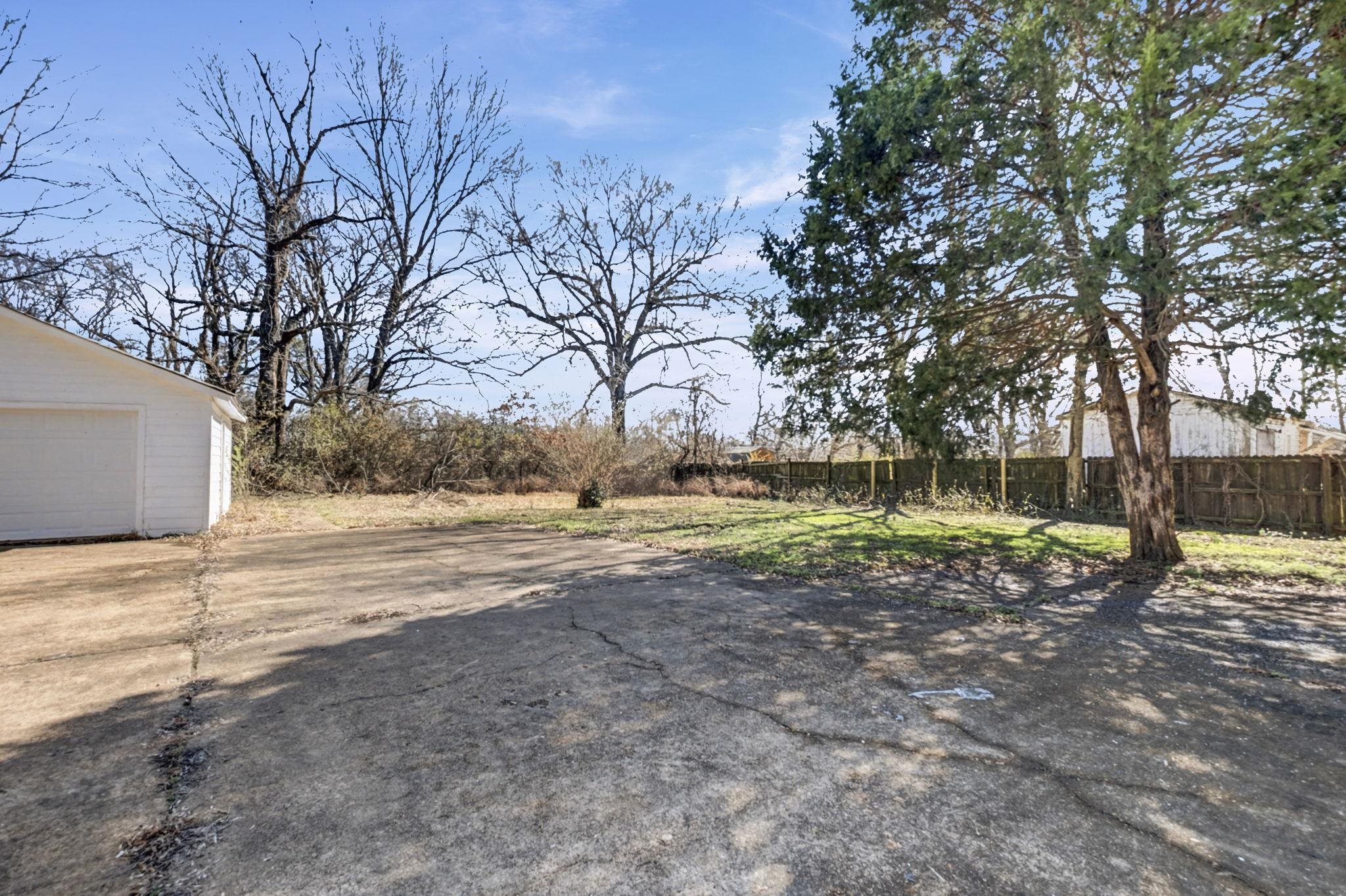 320 North High Street Covington, TN 38019 - Photo 18 of 32 a view of a yard with a tree