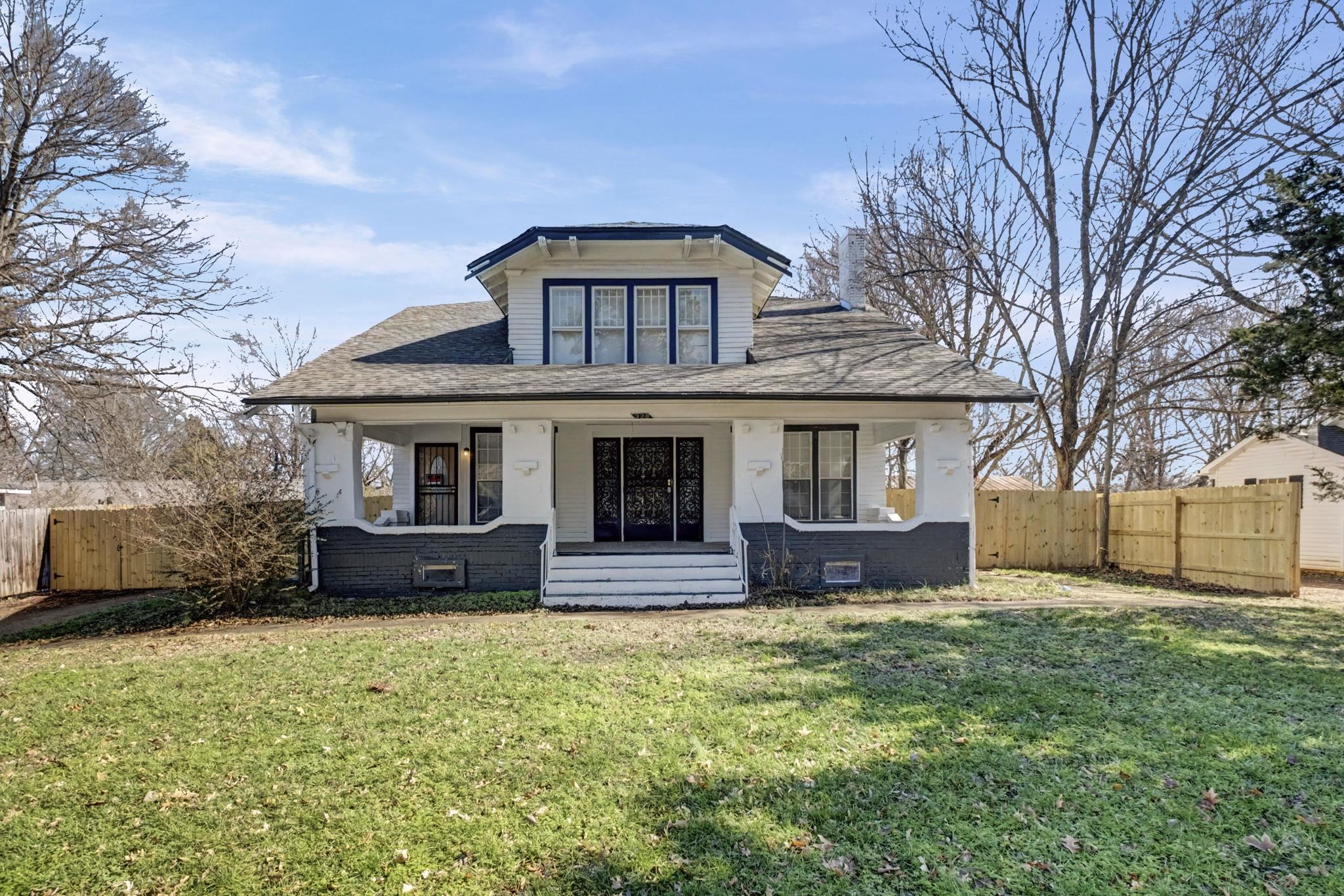 320 North High Street Covington, TN 38019 - Photo 22 of 32 a front view of a house with a yard