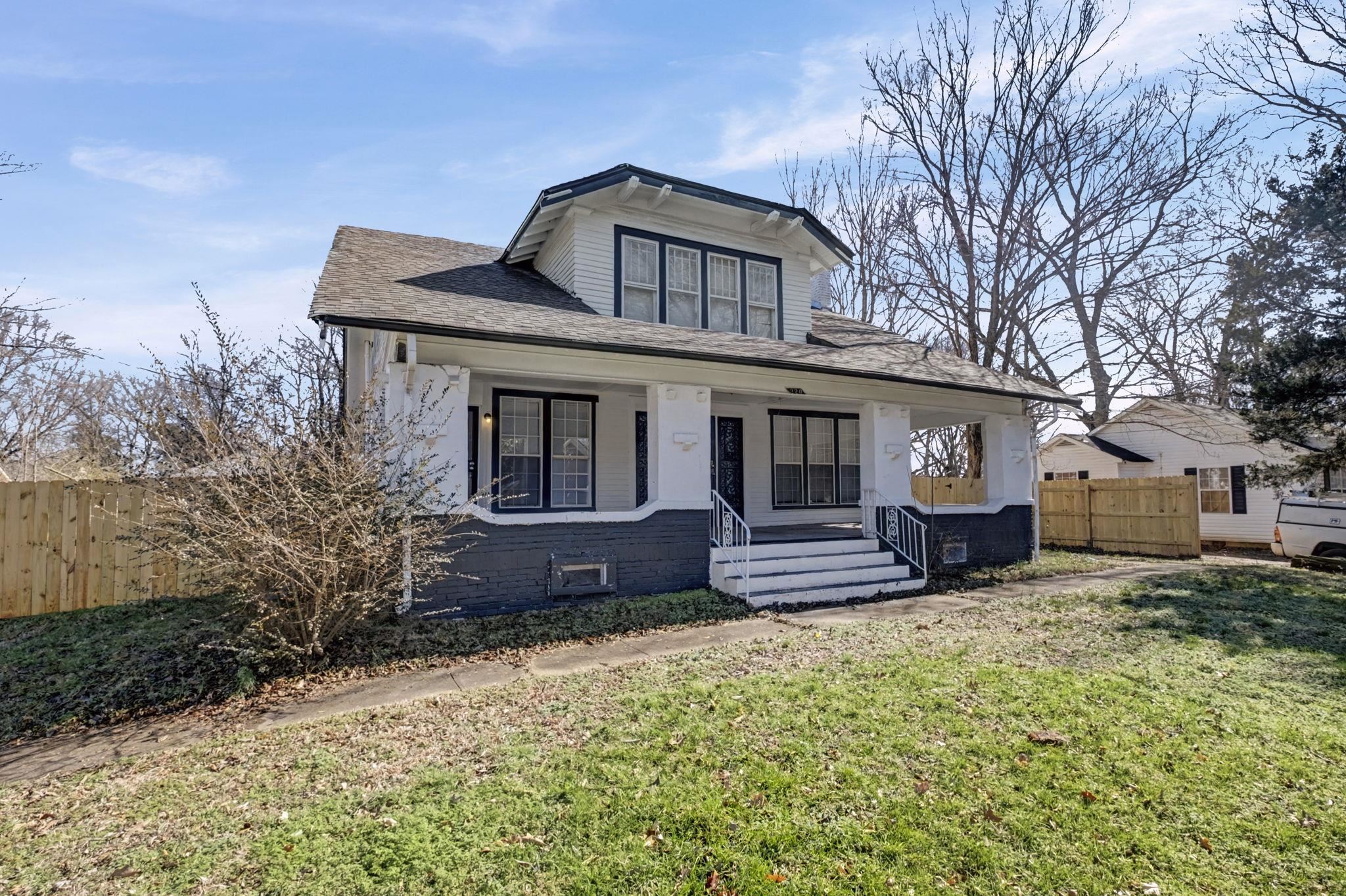 320 North High Street Covington, TN 38019 - Photo 24 of 32 a front view of a house with a yard