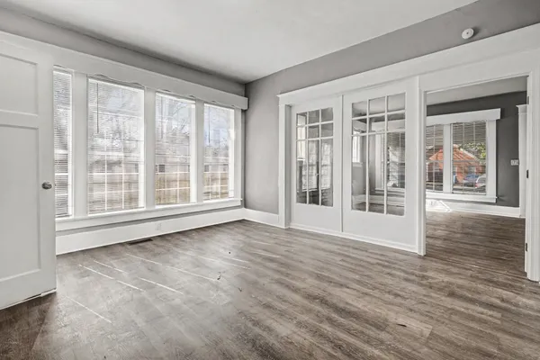 a kitchen with granite countertop a sink stove and cabinets