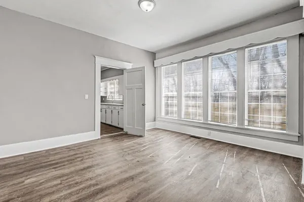 a kitchen with granite countertop a sink stove and cabinets
