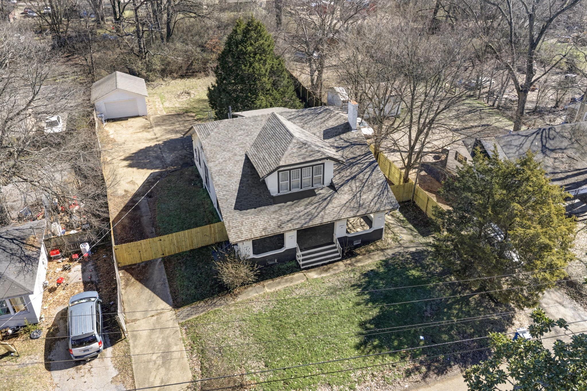 320 North High Street Covington, TN 38019 - Photo 3 of 32 a view of a house with a yard