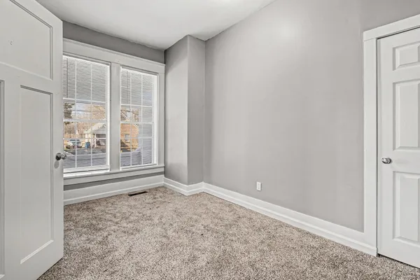 an empty room with windows