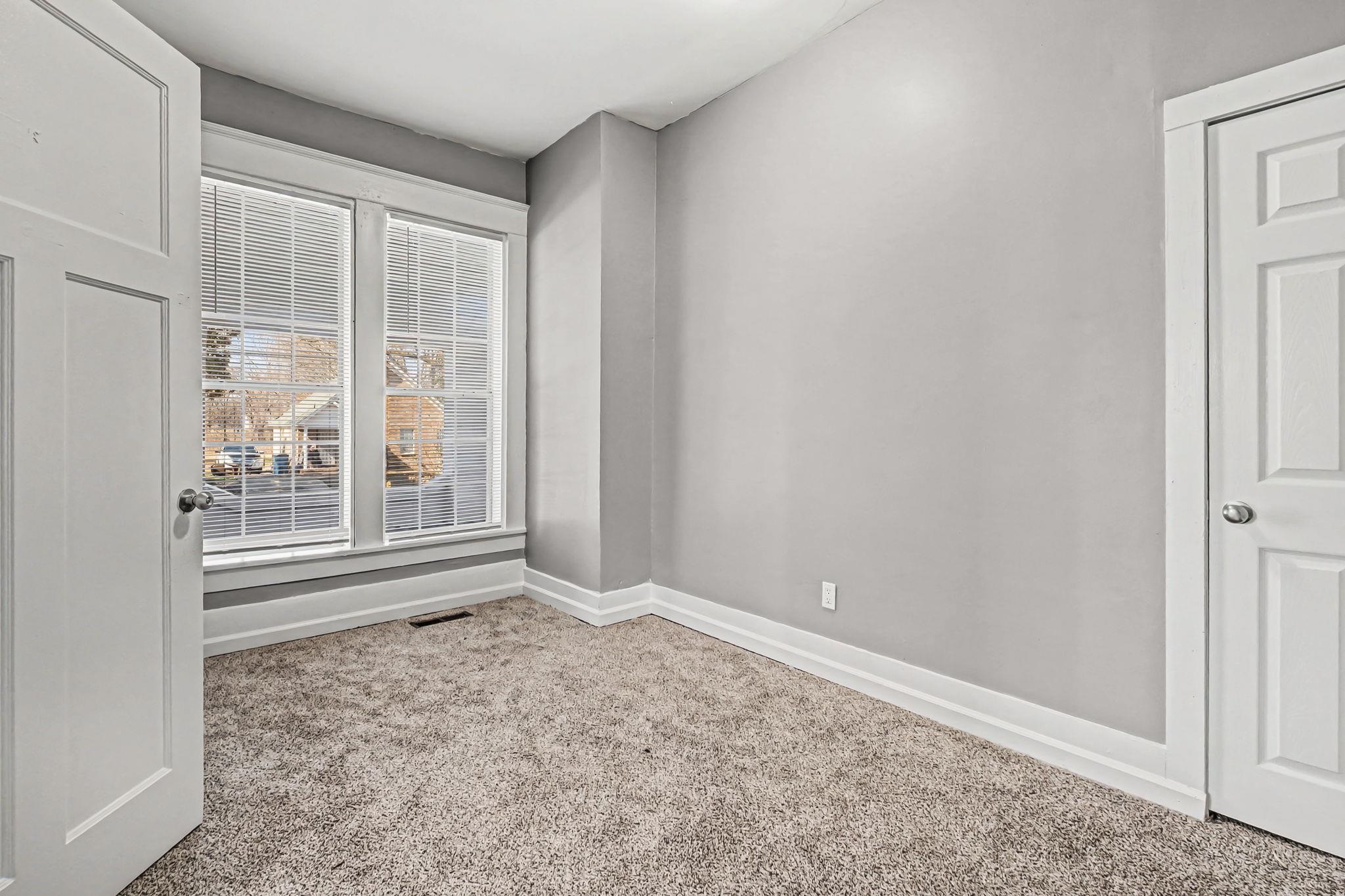 320 North High Street Covington, TN 38019 - Photo 10 of 32 a view of an empty room with a window