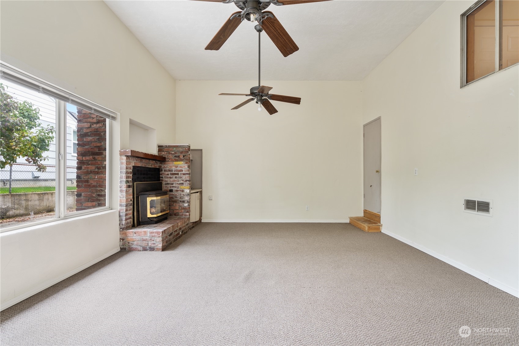 11632 24th Avenue South Seattle, WA 98168 - Photo 12 of 38 a view of a livingroom with a ceiling fan and window