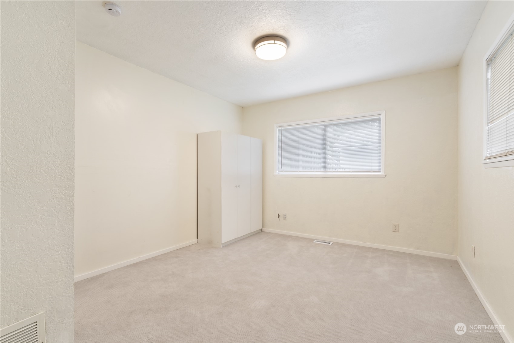 11632 24th Avenue South Seattle, WA 98168 - Photo 14 of 38 an empty room with windows