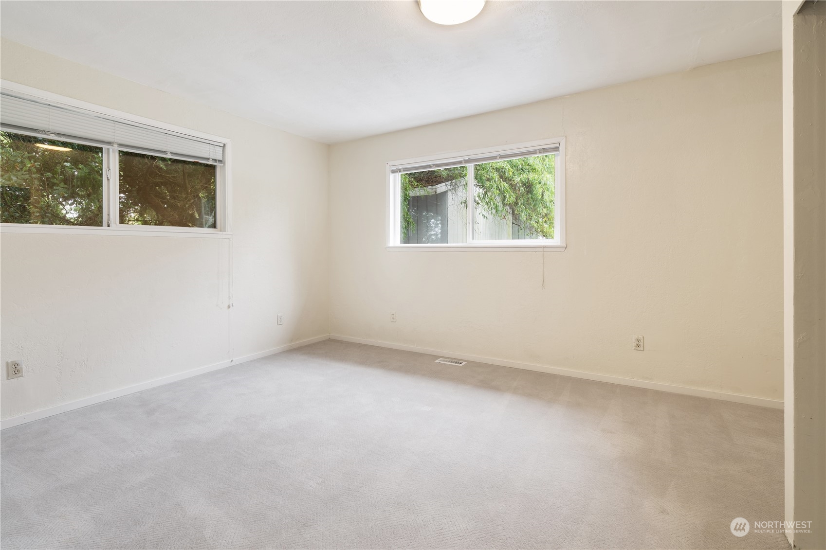 11632 24th Avenue South Seattle, WA 98168 - Photo 19 of 38 an empty room with windows