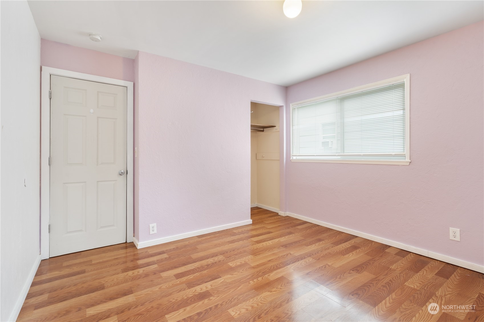 11632 24th Avenue South Seattle, WA 98168 - Photo 23 of 38 a view of an empty room with wooden floor and a window