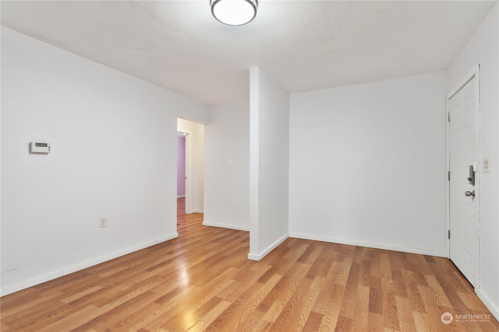 11632 24th Avenue South Seattle, WA 98168 - Photo 3 of 38 a view of empty room with wooden floor