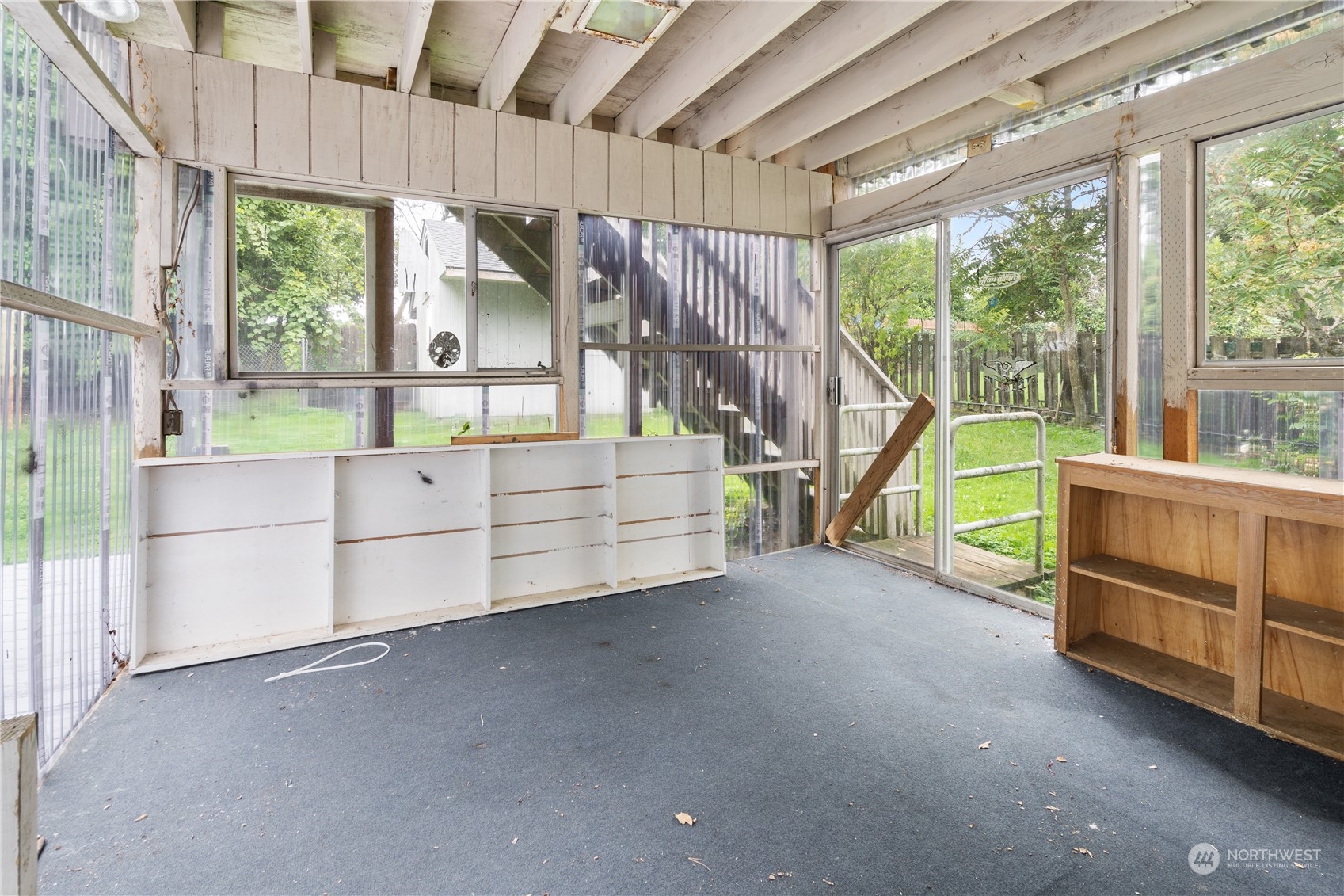 11632 24th Avenue South Seattle, WA 98168 - Photo 35 of 38 a view of a bedroom with furniture and a large window